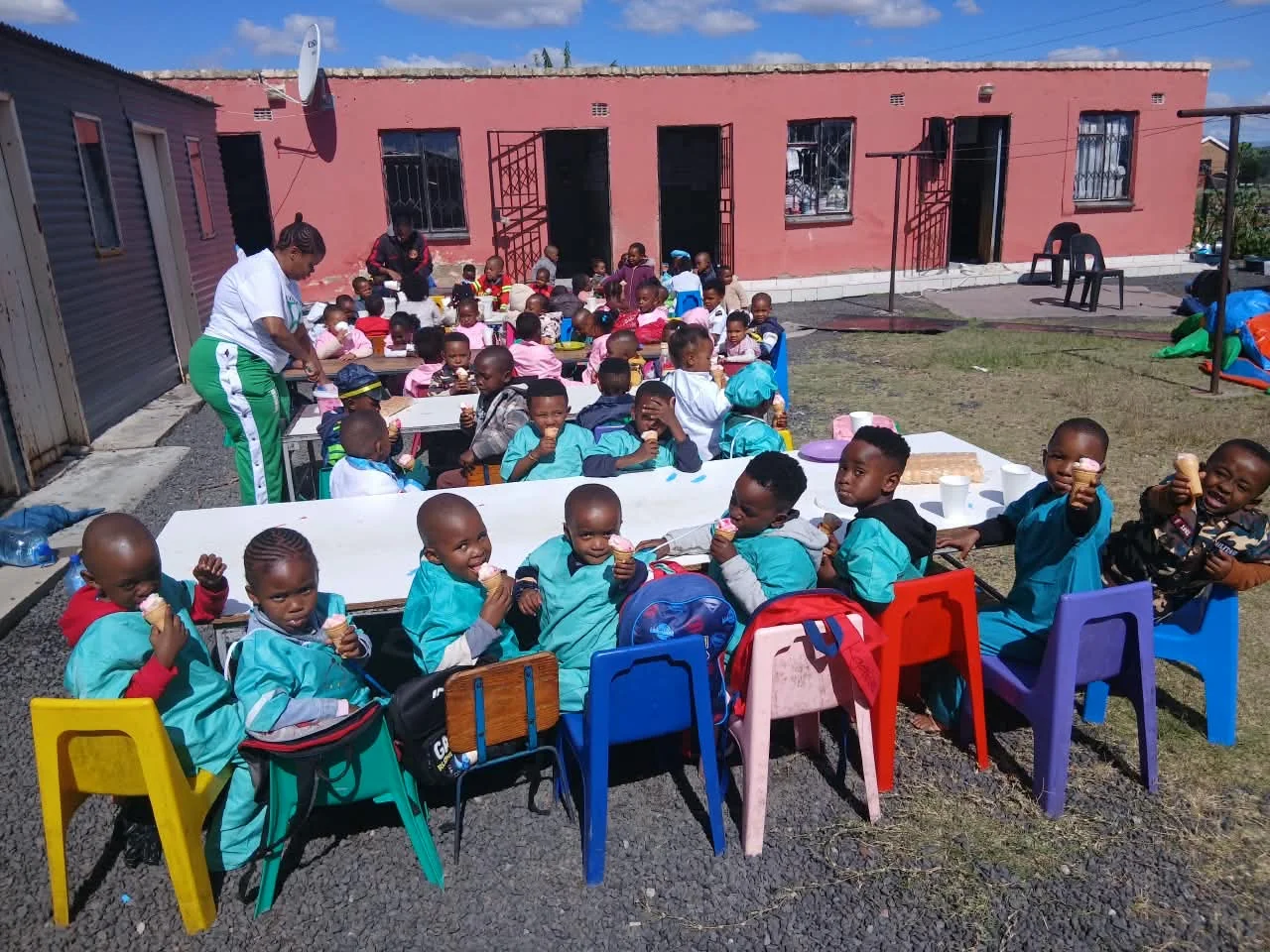 School building exterior with playground at Light Bearers Academy