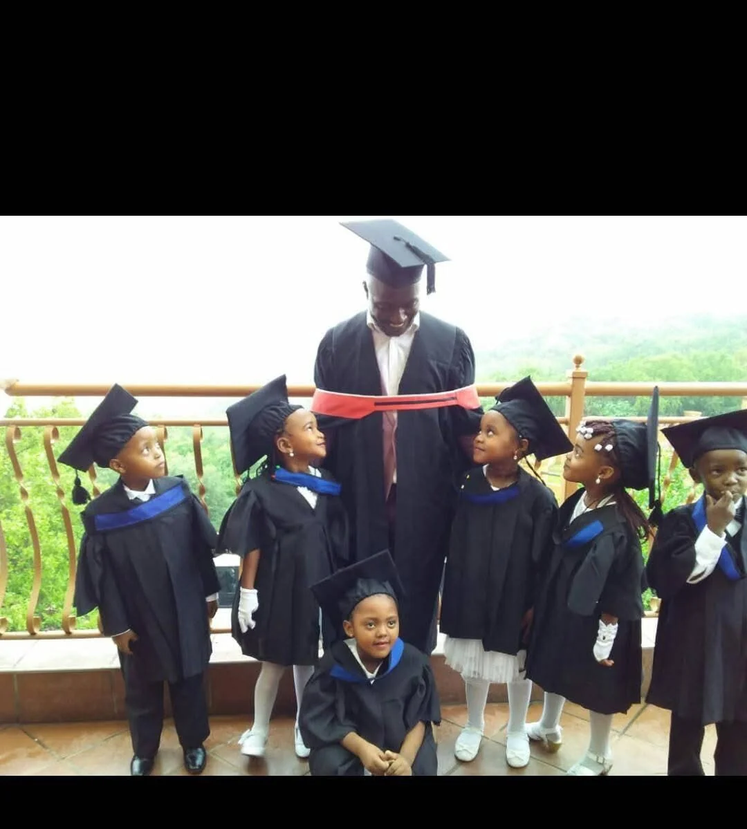School children celebrating graduation with smiling faces